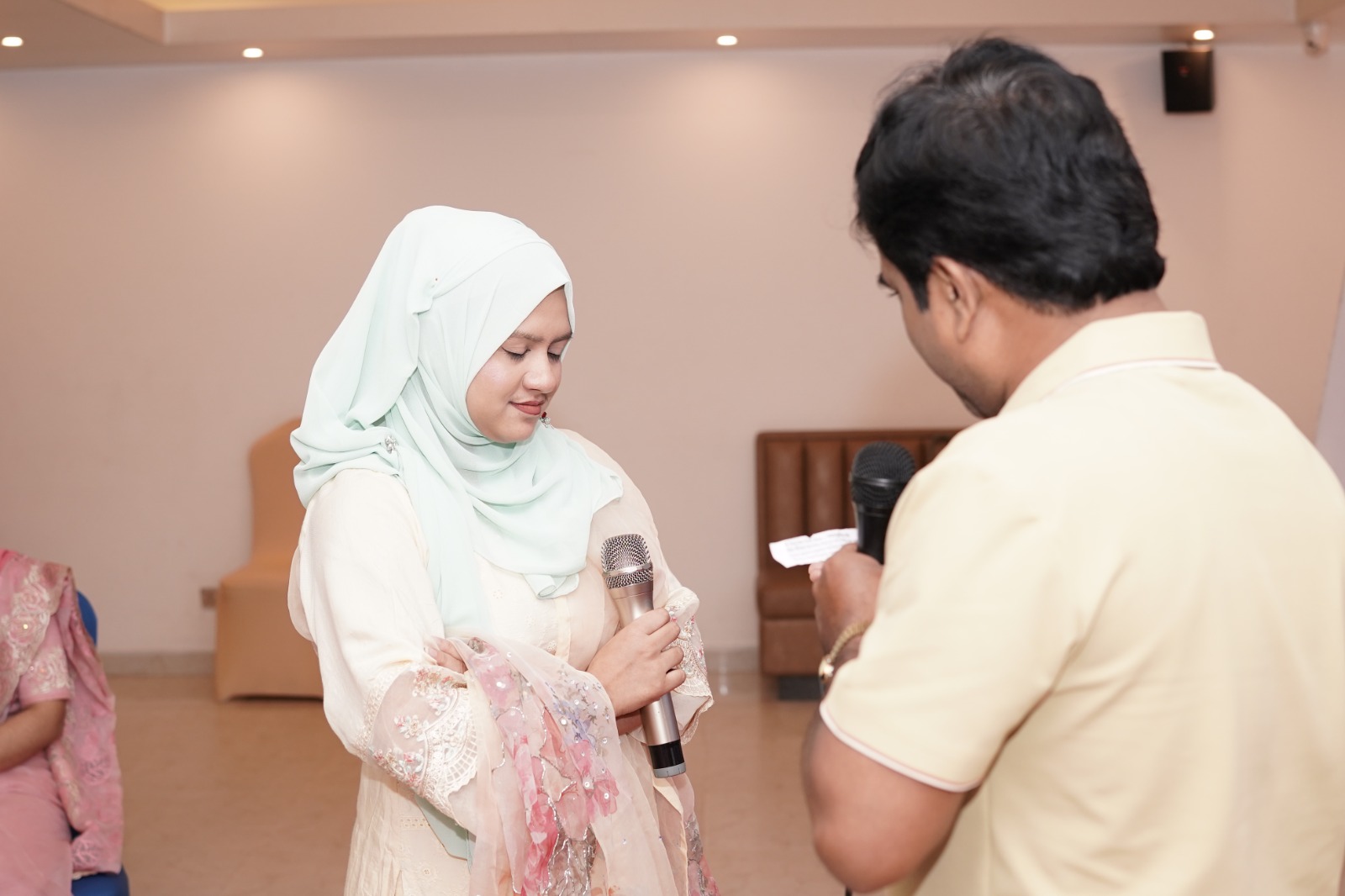 Facilitator in dialogue with a participant during a workshop