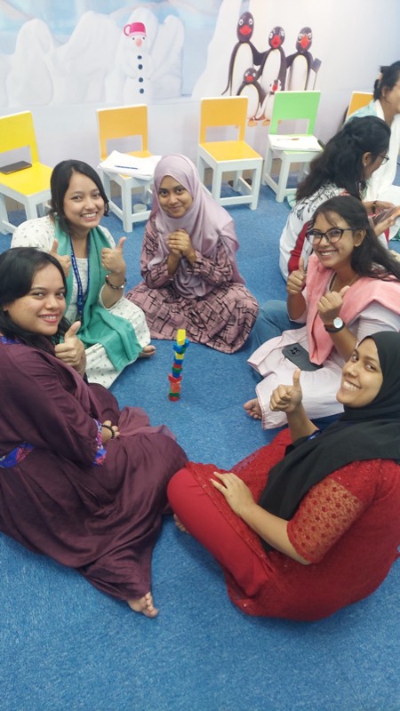 Early childhood teachers smiling during a training activity