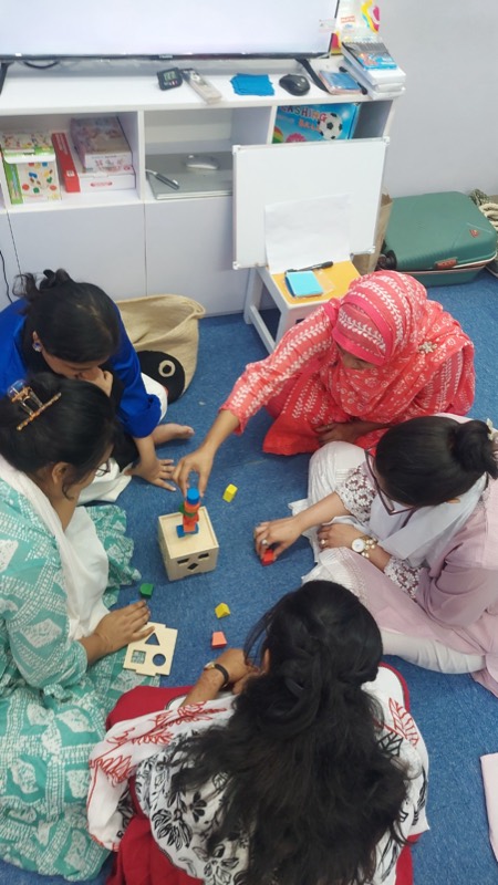 Teachers exploring early learning materials
