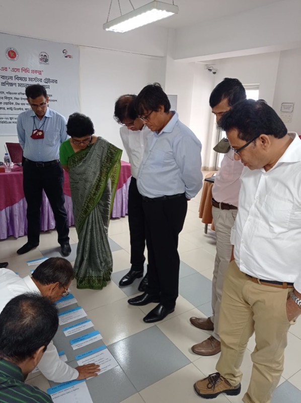 Education officials reviewing materials during a gallery walk
